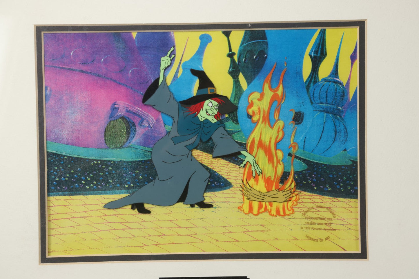 Lot 140 - Vintage Original Hand-Painted Animation Production Cel Featuring Mombi The Witch Conjuring Fire From "Journey Back To Oz," Filmation Associates, 1972, With Certificate Of Authenticity, 18-1/4" x 25-1/4"