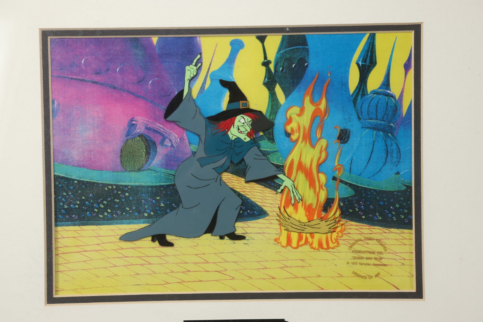Lot 140 - Vintage Original Hand-Painted Animation Production Cel Featuring Mombi The Witch Conjuring Fire From "Journey Back To Oz," Filmation Associates, 1972, With Certificate Of Authenticity, 18-1/4" x 25-1/4"