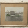 Lot 156 - Vintage Hand-Colored Boarded Photograph Of Steamboat “Coquet” Passing Algoma Street Bridge And Lumber Mill, Oshkosh, Wisconsin, Early 20th Century, Framed, 14-3/8" x 11-7/8"