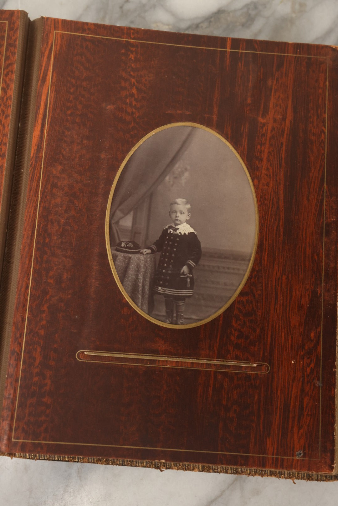 Lot 159 - Antique Victorian Family Photo Album With Brown Leather Covers And Brass Clasp Containing 18 Cabinet Cards, 13 Carte De Visite CDV Photographs, 9 Tintypes, And 4 Long Cabinet Cards Including Hidden Mother And Black Baby Portraits