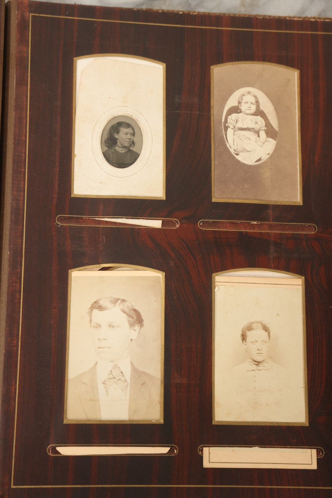 Lot 159 - Antique Victorian Family Photo Album With Brown Leather Covers And Brass Clasp Containing 18 Cabinet Cards, 13 Carte De Visite CDV Photographs, 9 Tintypes, And 4 Long Cabinet Cards Including Hidden Mother And Black Baby Portraits