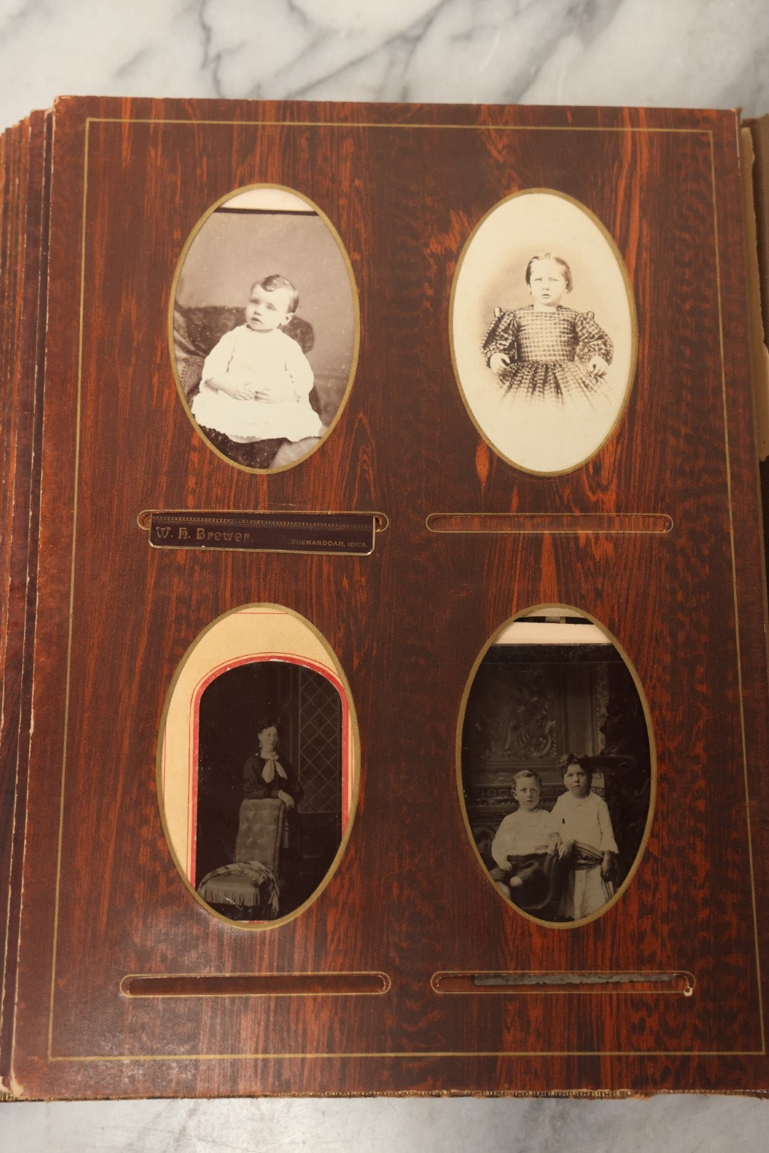 Lot 159 - Antique Victorian Family Photo Album With Brown Leather Covers And Brass Clasp Containing 18 Cabinet Cards, 13 Carte De Visite CDV Photographs, 9 Tintypes, And 4 Long Cabinet Cards Including Hidden Mother And Black Baby Portraits
