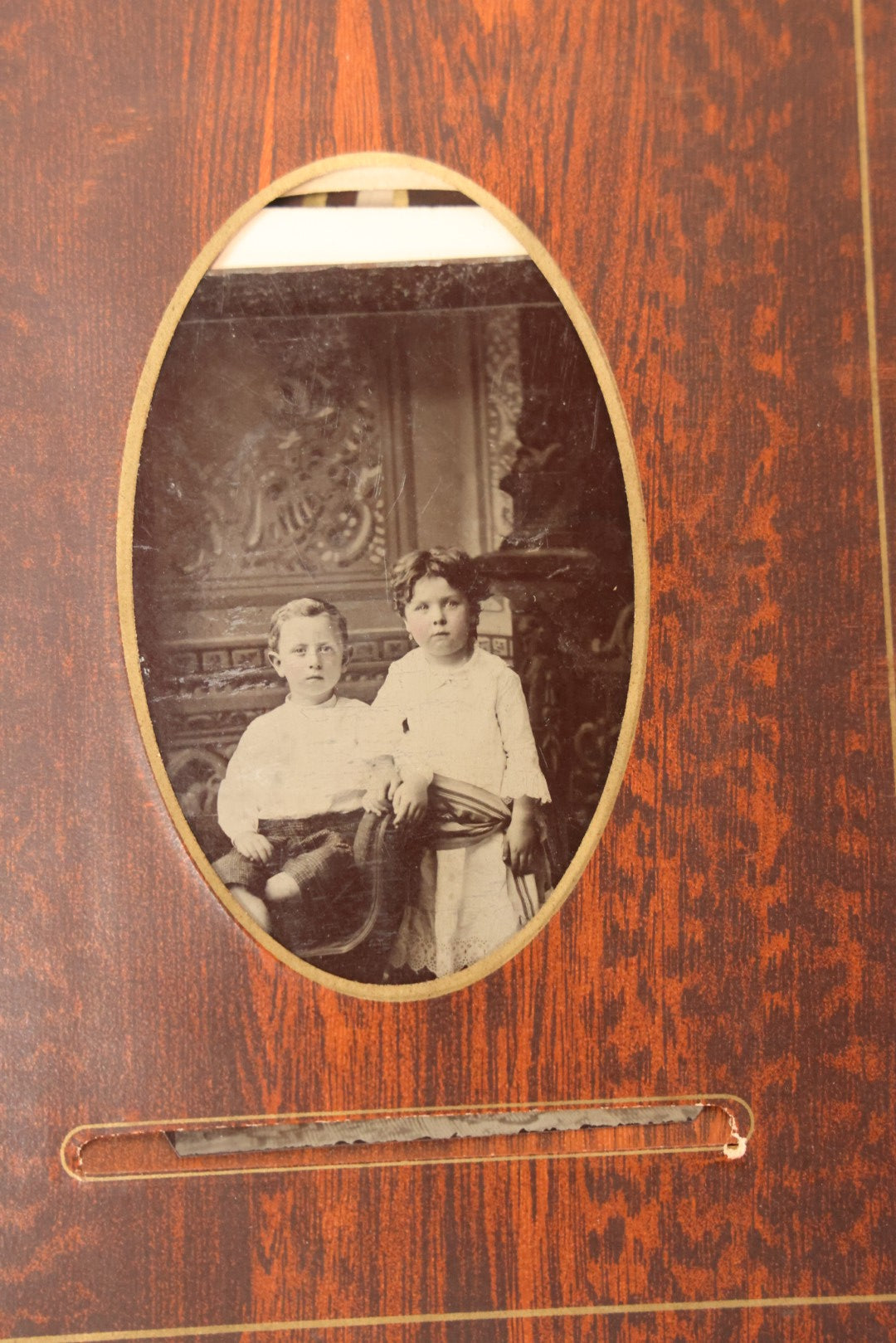 Lot 159 - Antique Victorian Family Photo Album With Brown Leather Covers And Brass Clasp Containing 18 Cabinet Cards, 13 Carte De Visite CDV Photographs, 9 Tintypes, And 4 Long Cabinet Cards Including Hidden Mother And Black Baby Portraits