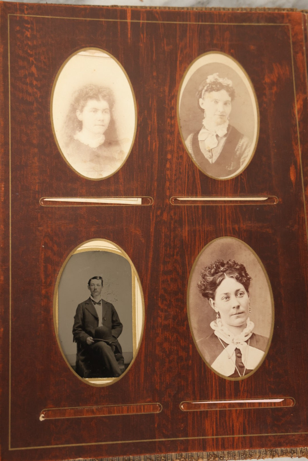 Lot 159 - Antique Victorian Family Photo Album With Brown Leather Covers And Brass Clasp Containing 18 Cabinet Cards, 13 Carte De Visite CDV Photographs, 9 Tintypes, And 4 Long Cabinet Cards Including Hidden Mother And Black Baby Portraits