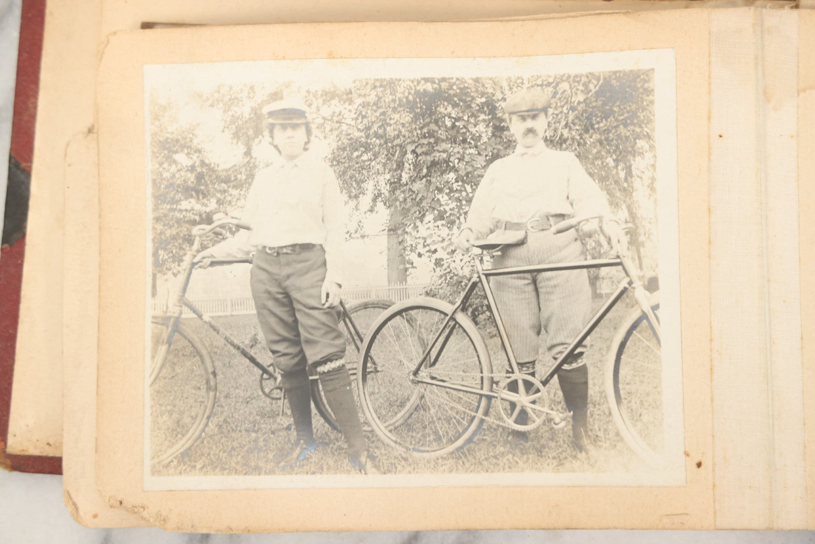 Lot 160 - Antique Snapshot Photo Album With Nineteen Photographs Including Men With Bicycles, Women At Beach, Dog Photos, And Family Memorial, Badger Plain Leaf Album No. 701 By Heinn Specialty Co., Milwaukee, Wisconsin, Circa 1895