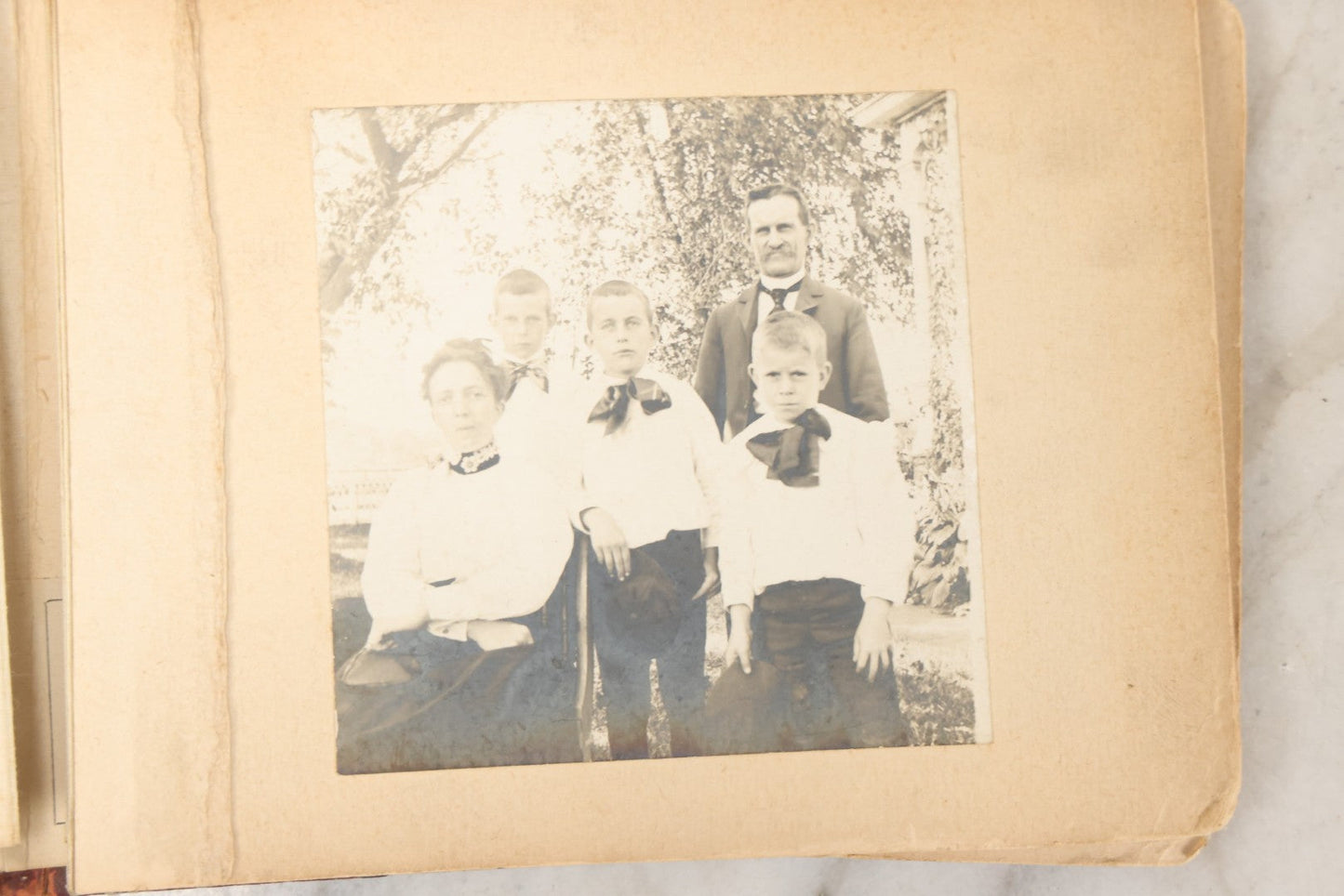Lot 160 - Antique Snapshot Photo Album With Nineteen Photographs Including Men With Bicycles, Women At Beach, Dog Photos, And Family Memorial, Badger Plain Leaf Album No. 701 By Heinn Specialty Co., Milwaukee, Wisconsin, Circa 1895