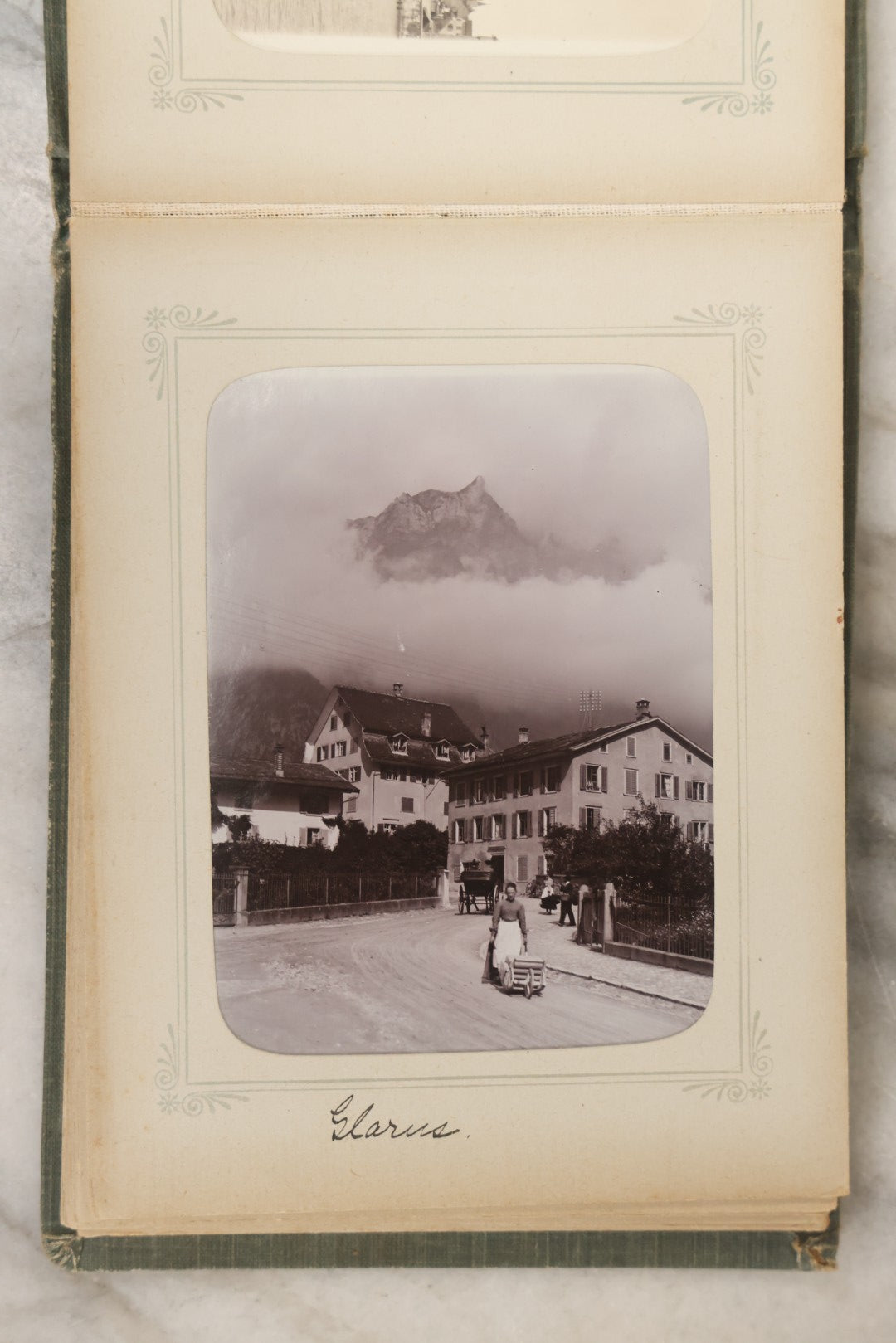 Lot 161 - "Photographien" Antique European Travel Photo Album, Green Hardcover With Black Plaid Stripe Design, Inscribed 1903, Containing Travel Photographs Of Switzerland With Captions