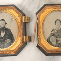 Lot 163 - Pair Of Antique 1/6th Plate Ambrotype Photographs Of Man And Woman Holding Books In Double Sided Thermoplastic Union Case, Note Damage