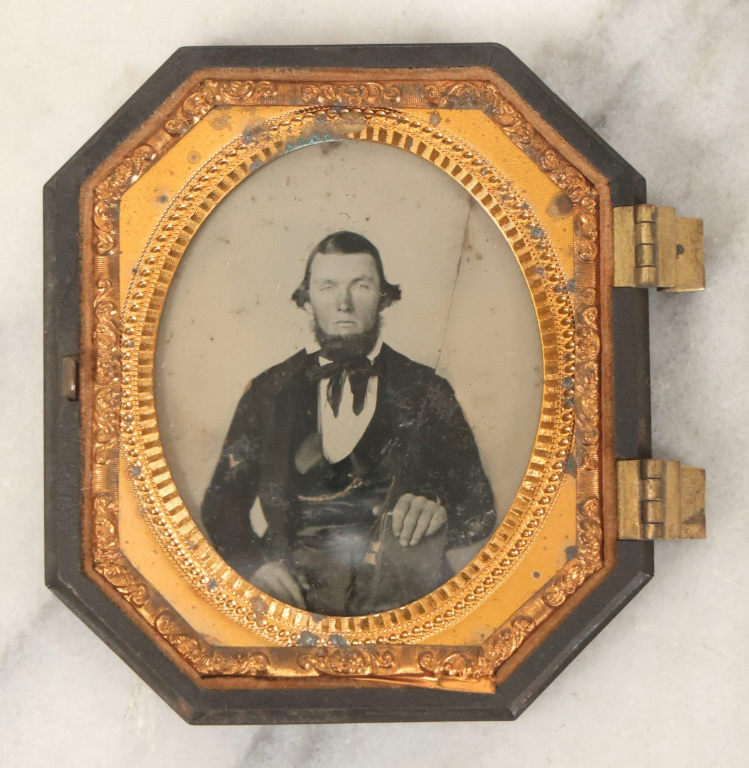 Lot 163 - Pair Of Antique 1/6th Plate Ambrotype Photographs Of Man And Woman Holding Books In Double Sided Thermoplastic Union Case, Note Damage