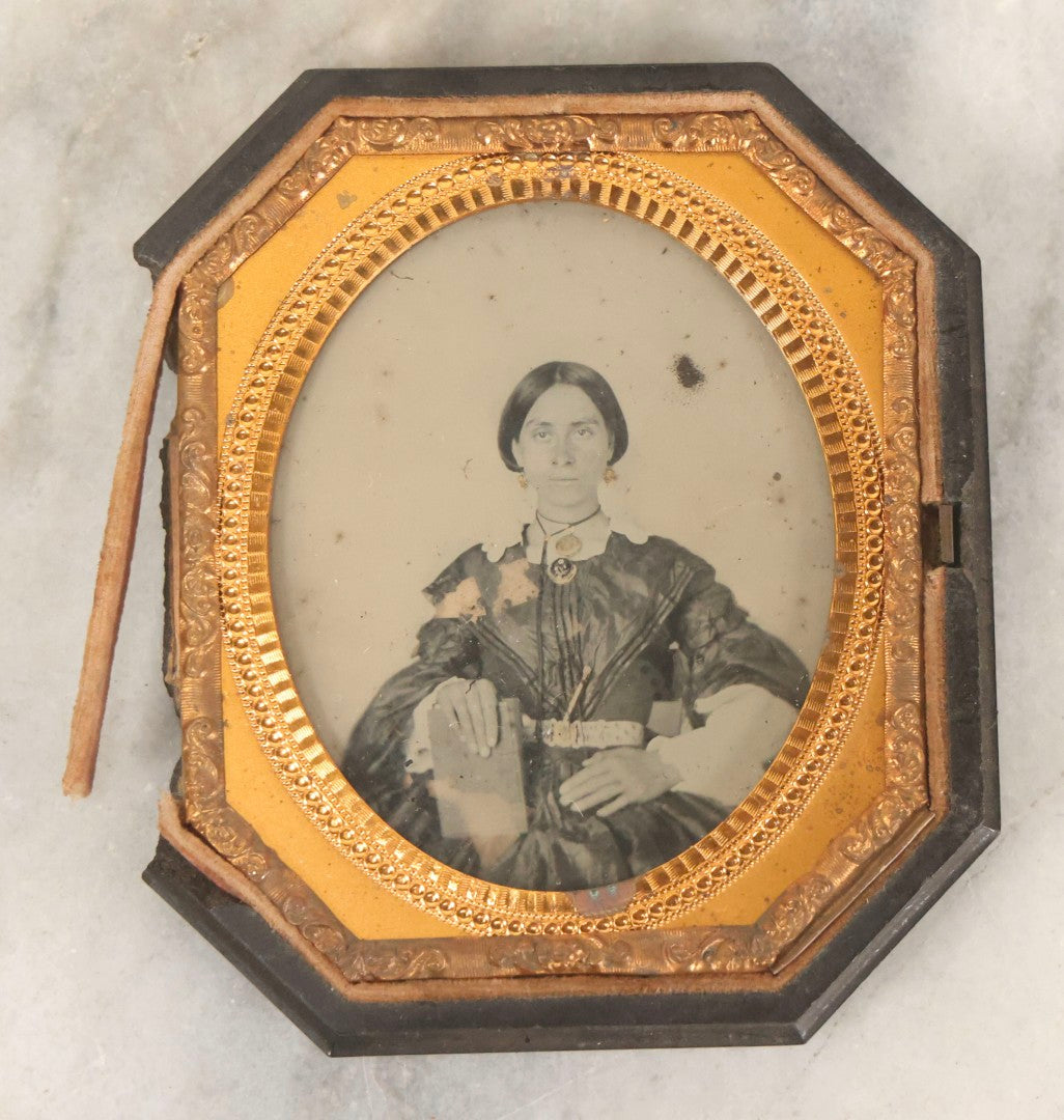 Lot 163 - Pair Of Antique 1/6th Plate Ambrotype Photographs Of Man And Woman Holding Books In Double Sided Thermoplastic Union Case, Note Damage