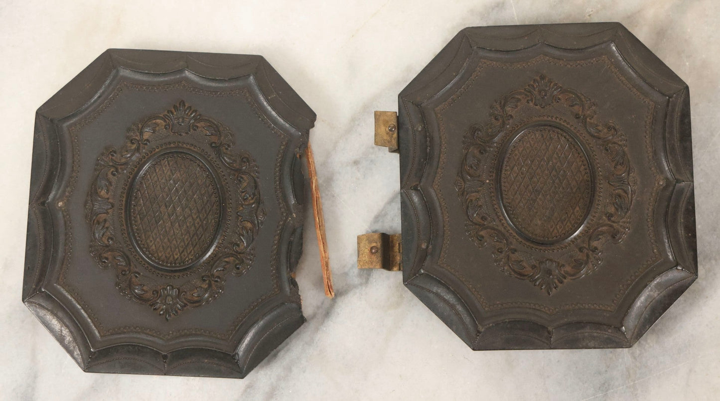 Lot 163 - Pair Of Antique 1/6th Plate Ambrotype Photographs Of Man And Woman Holding Books In Double Sided Thermoplastic Union Case, Note Damage
