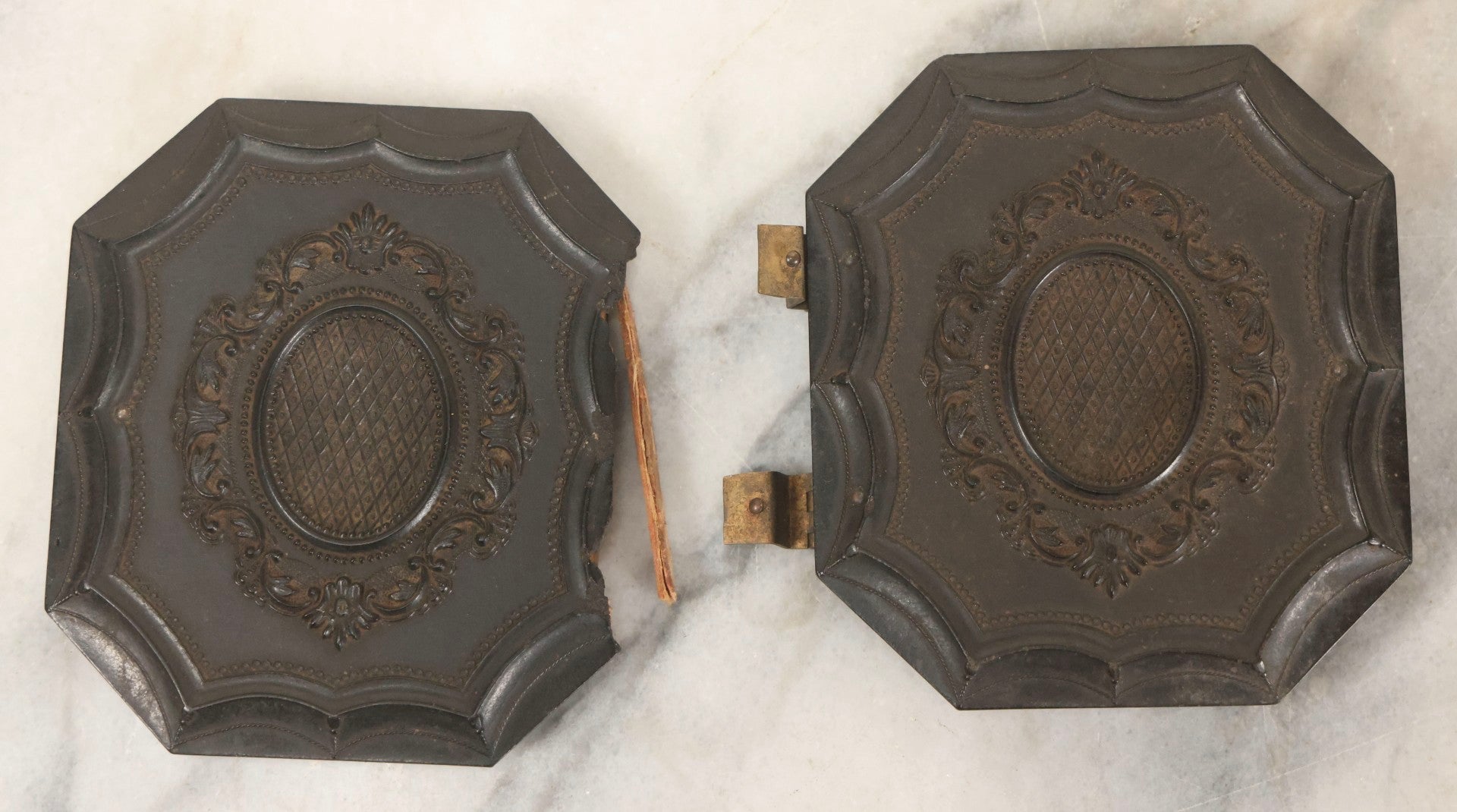 Lot 163 - Pair Of Antique 1/6th Plate Ambrotype Photographs Of Man And Woman Holding Books In Double Sided Thermoplastic Union Case, Note Damage