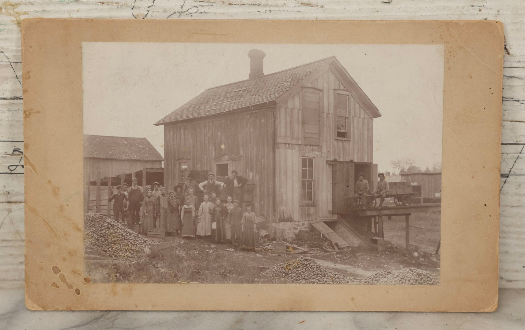 Lot 167 - Antique Boarded Occupational Photograph Of Farm Workers With Apple Harvest, Bad River Reservation, Northern Wisconsin