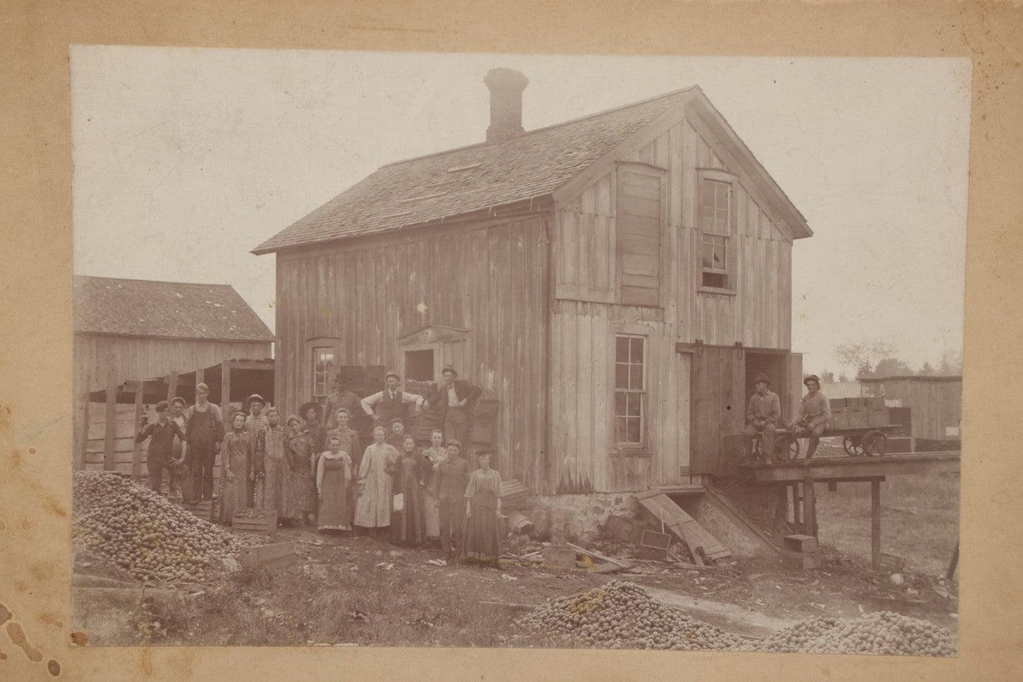 Lot 167 - Antique Boarded Occupational Photograph Of Farm Workers With Apple Harvest, Bad River Reservation, Northern Wisconsin