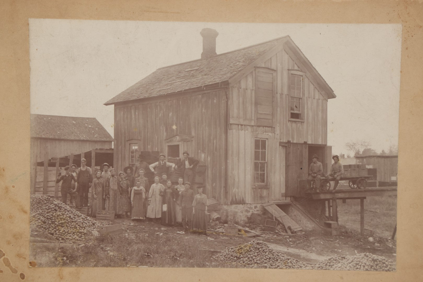 Lot 167 - Antique Boarded Occupational Photograph Of Farm Workers With Apple Harvest, Bad River Reservation, Northern Wisconsin