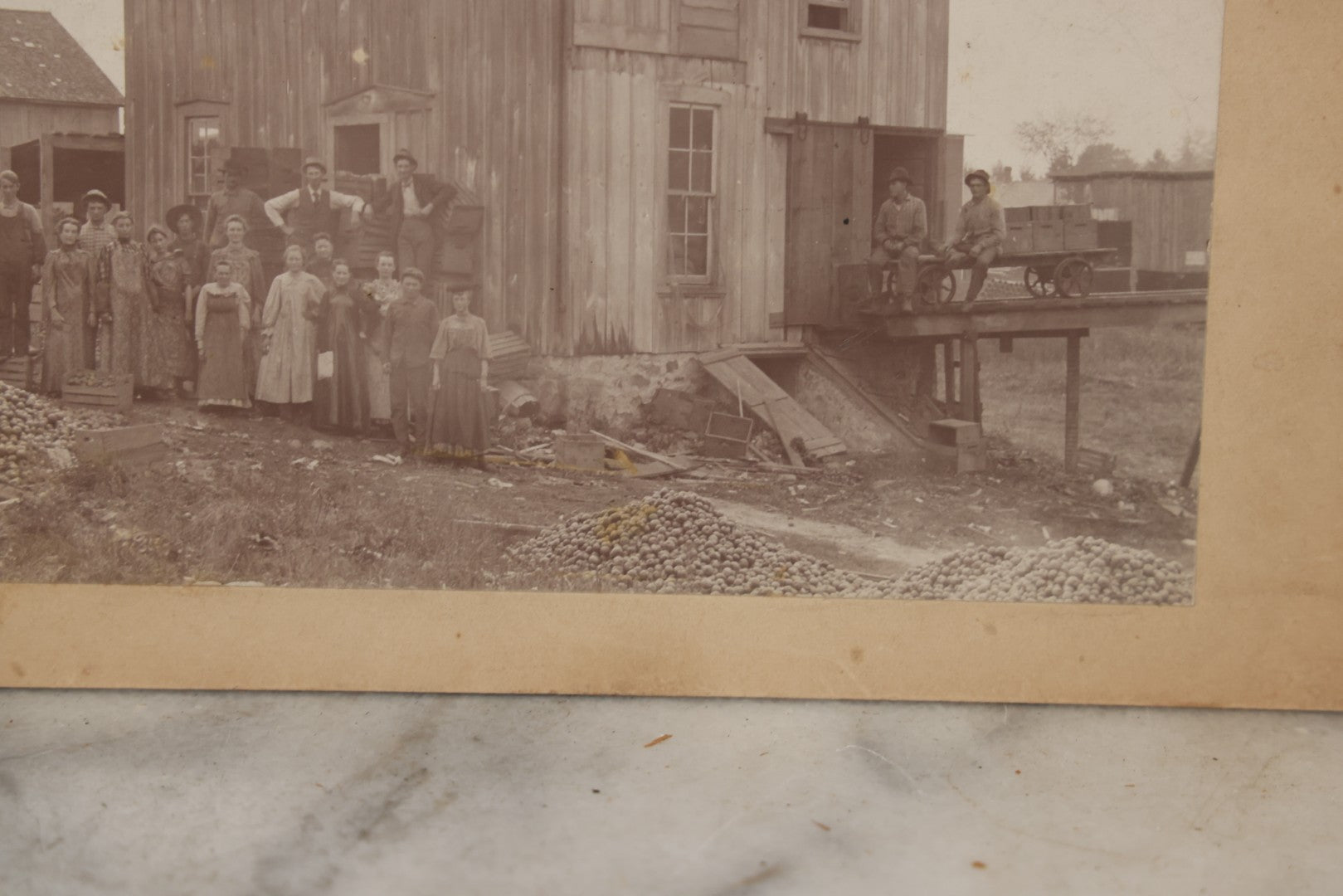 Lot 167 - Antique Boarded Occupational Photograph Of Farm Workers With Apple Harvest, Bad River Reservation, Northern Wisconsin