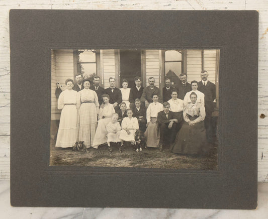 Lot 171 - Antique Boarded Group Family Photograph Of Three Generations Posed On Steps Of House With Two Dogs