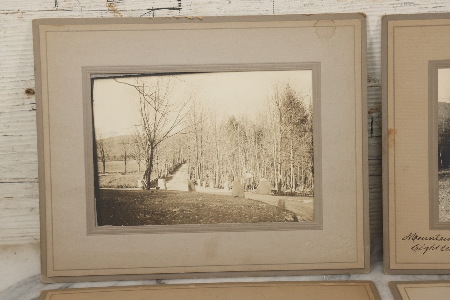 Lot 173 - Grouping Of Four Antique Photographs In Paper Slip Frames Depicting Memorial Road And Surroundings, Photographed By Johnson Studios, East Jaffrey, New Hampshire