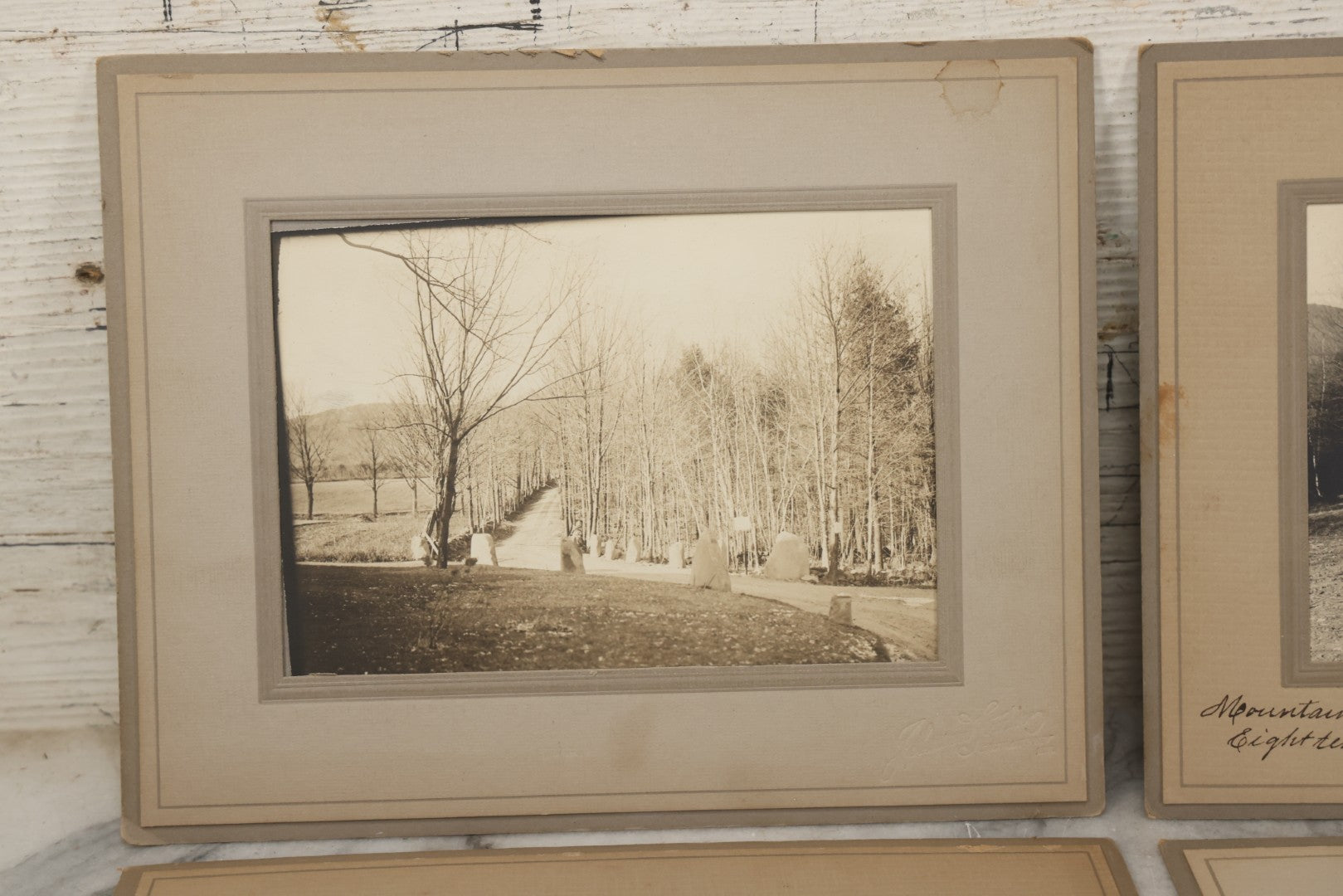 Lot 173 - Grouping Of Four Antique Photographs In Paper Slip Frames Depicting Memorial Road And Surroundings, Photographed By Johnson Studios, East Jaffrey, New Hampshire