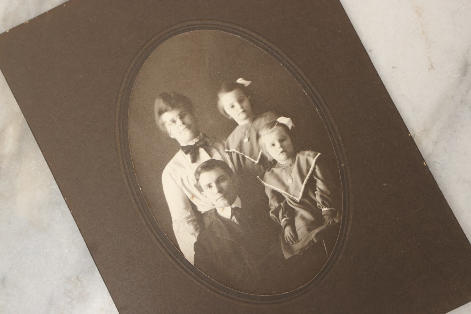 Lot 177 - Grouping Of Twelve Antique Photographs, Mostly Boarded, Including Wedding, Children, And Women Portraits, Circa 1880–1900