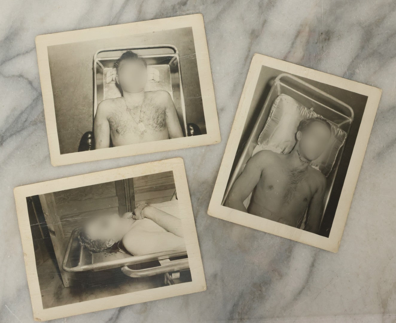 Lot 178 - Grouping Of Three Vintage World War II Snapshot Photographs Depicting Deceased Soldiers With Combat Injuries — Content Warning: Graphic Wartime Imagery