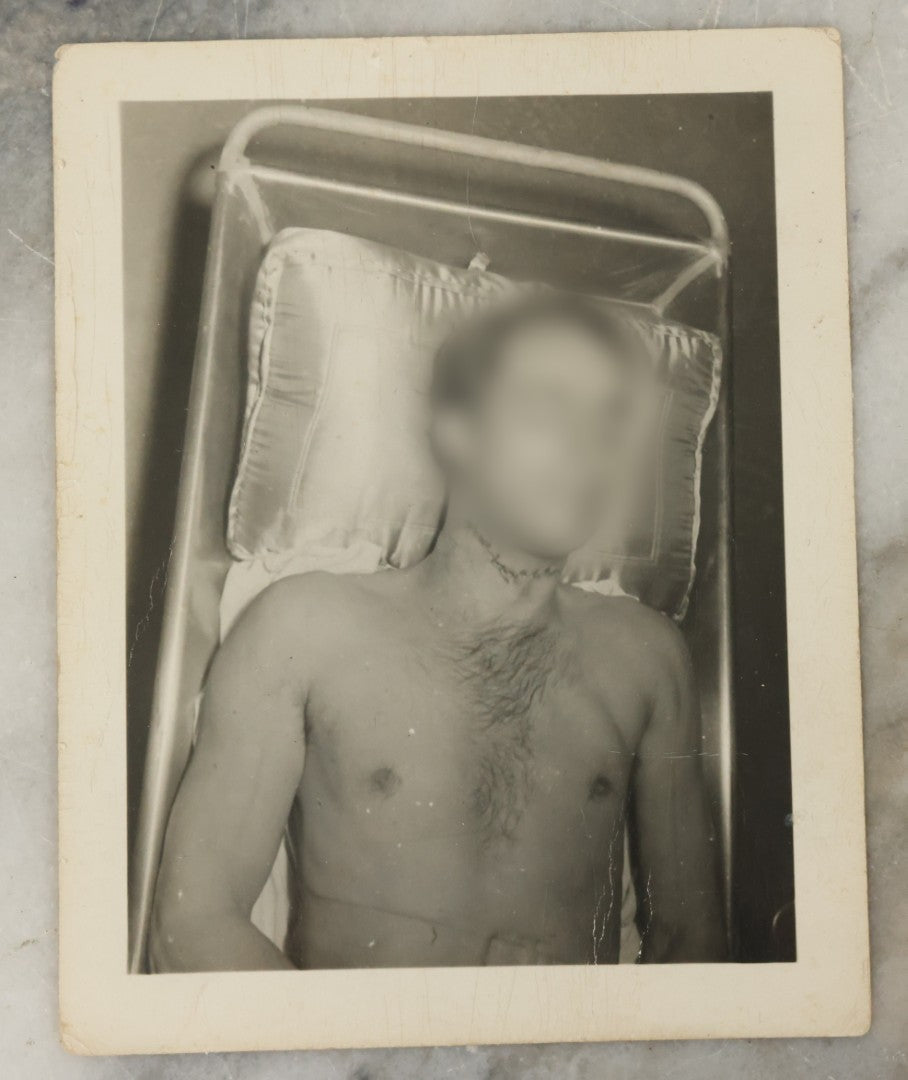 Lot 178 - Grouping Of Three Vintage World War II Snapshot Photographs Depicting Deceased Soldiers With Combat Injuries — Content Warning: Graphic Wartime Imagery