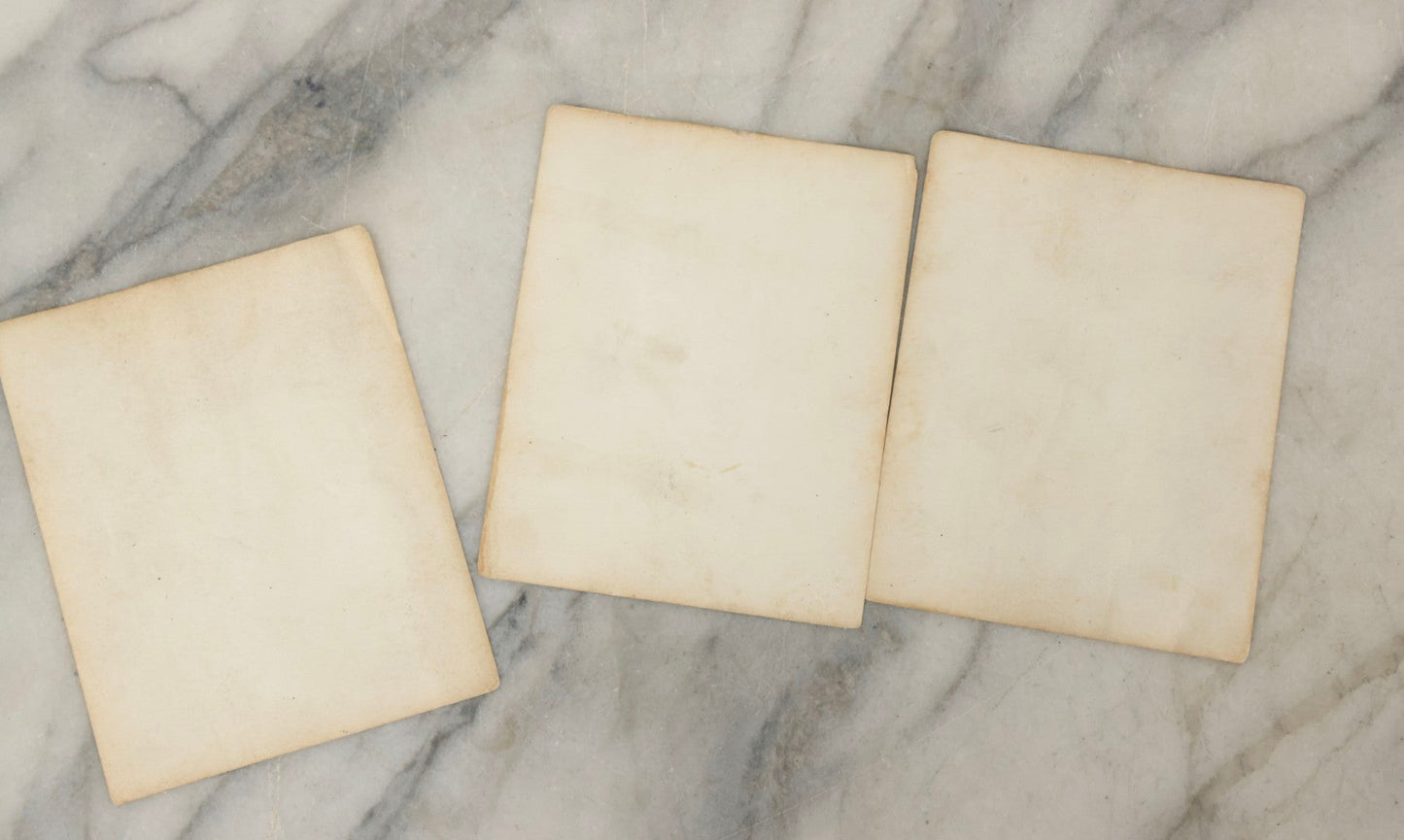 Lot 178 - Grouping Of Three Vintage World War II Snapshot Photographs Depicting Deceased Soldiers With Combat Injuries — Content Warning: Graphic Wartime Imagery