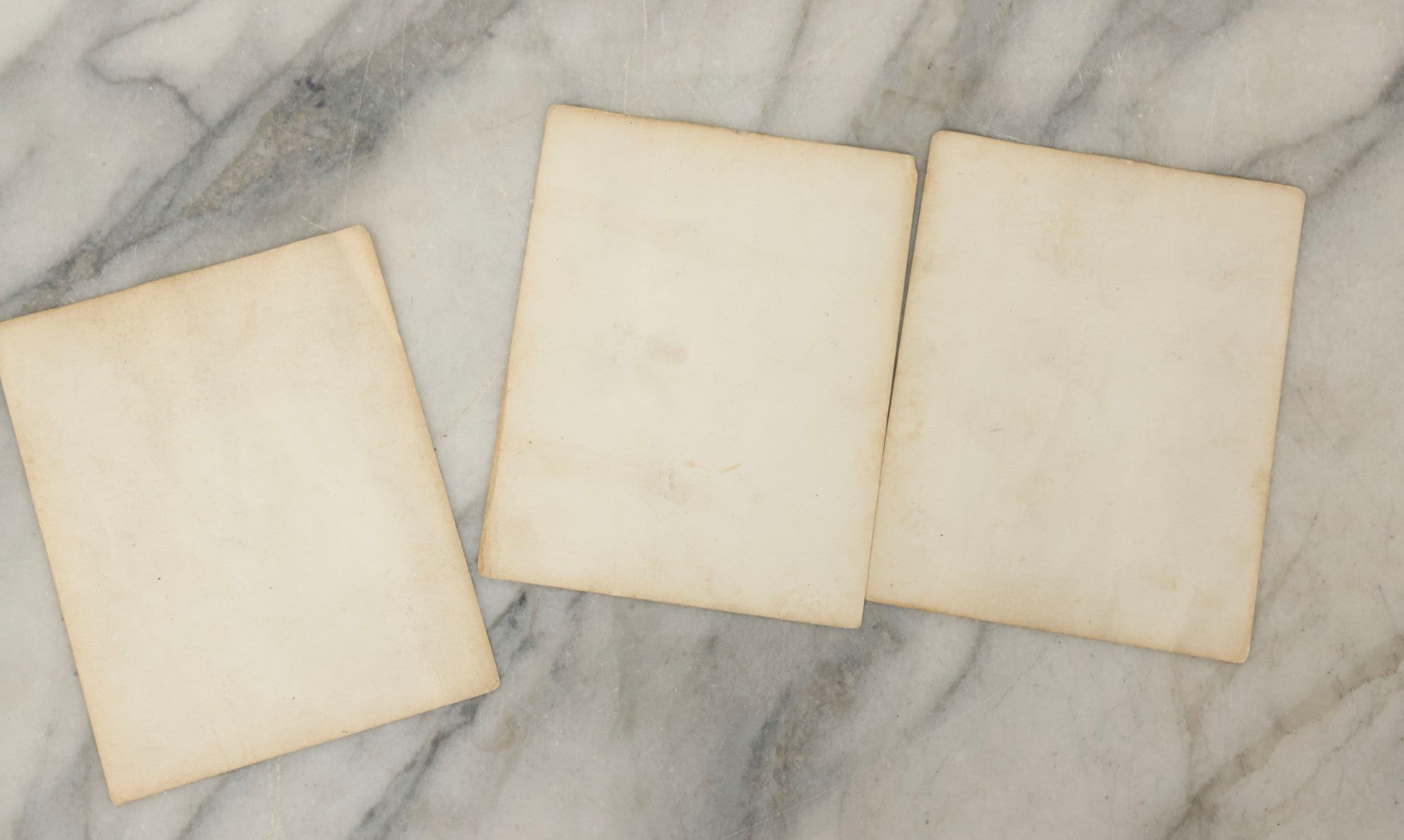 Lot 178 - Grouping Of Three Vintage World War II Snapshot Photographs Depicting Deceased Soldiers With Combat Injuries — Content Warning: Graphic Wartime Imagery