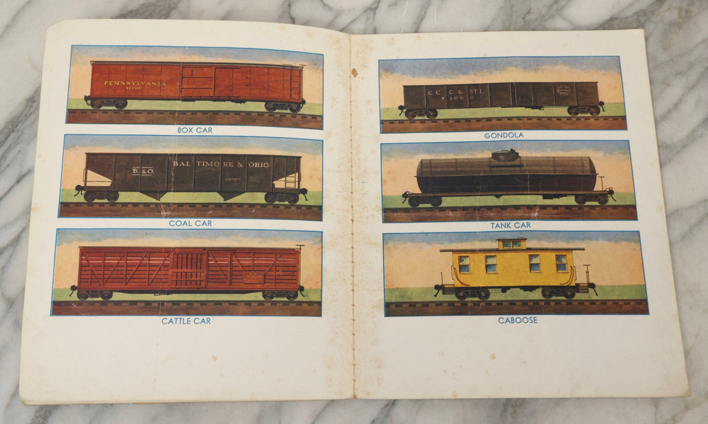 Lot 203 - Grouping Of 3 Antique And Vintage Industrial-Themed Children's Books Including “Railroad Book” By McLoughlin Bros., “Book Of Trains” By Grif Teller, And “Oil Comes To Us” By Rose Wyler And Warren W. McSpadden