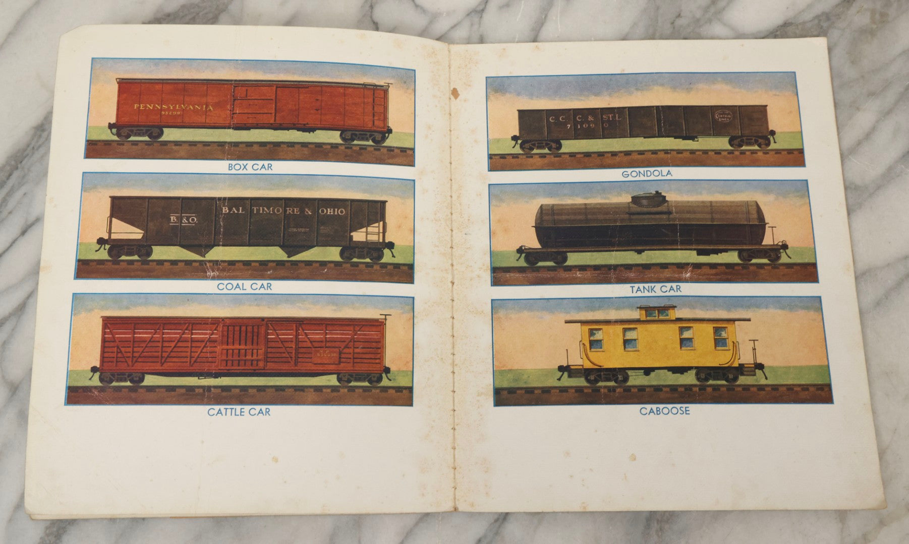 Lot 203 - Grouping Of 3 Antique And Vintage Industrial-Themed Children's Books Including “Railroad Book” By McLoughlin Bros., “Book Of Trains” By Grif Teller, And “Oil Comes To Us” By Rose Wyler And Warren W. McSpadden