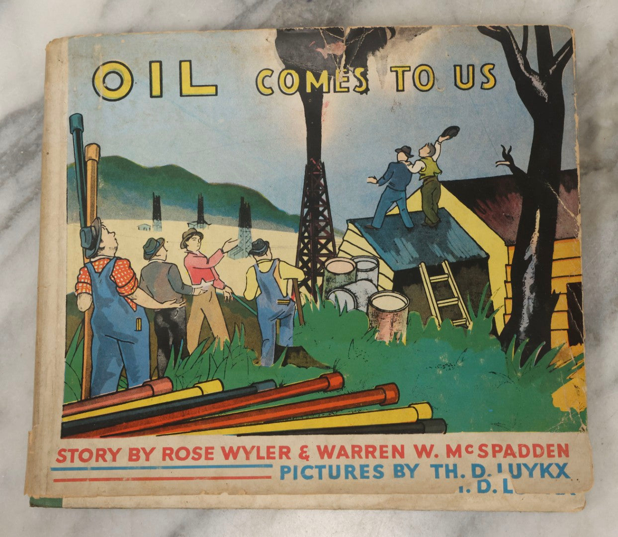 Lot 203 - Grouping Of 3 Antique And Vintage Industrial-Themed Children's Books Including “Railroad Book” By McLoughlin Bros., “Book Of Trains” By Grif Teller, And “Oil Comes To Us” By Rose Wyler And Warren W. McSpadden