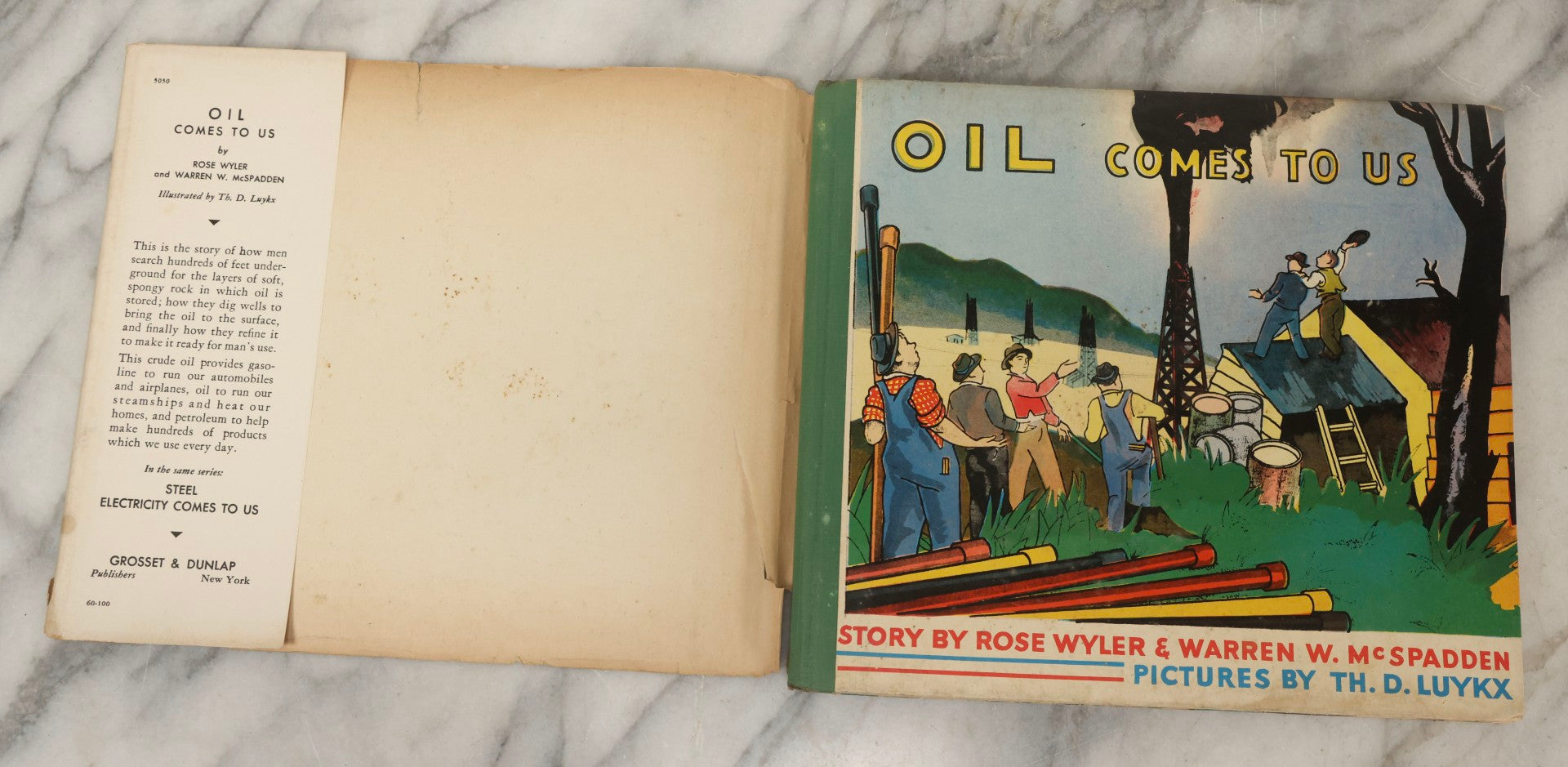 Lot 203 - Grouping Of 3 Antique And Vintage Industrial-Themed Children's Books Including “Railroad Book” By McLoughlin Bros., “Book Of Trains” By Grif Teller, And “Oil Comes To Us” By Rose Wyler And Warren W. McSpadden
