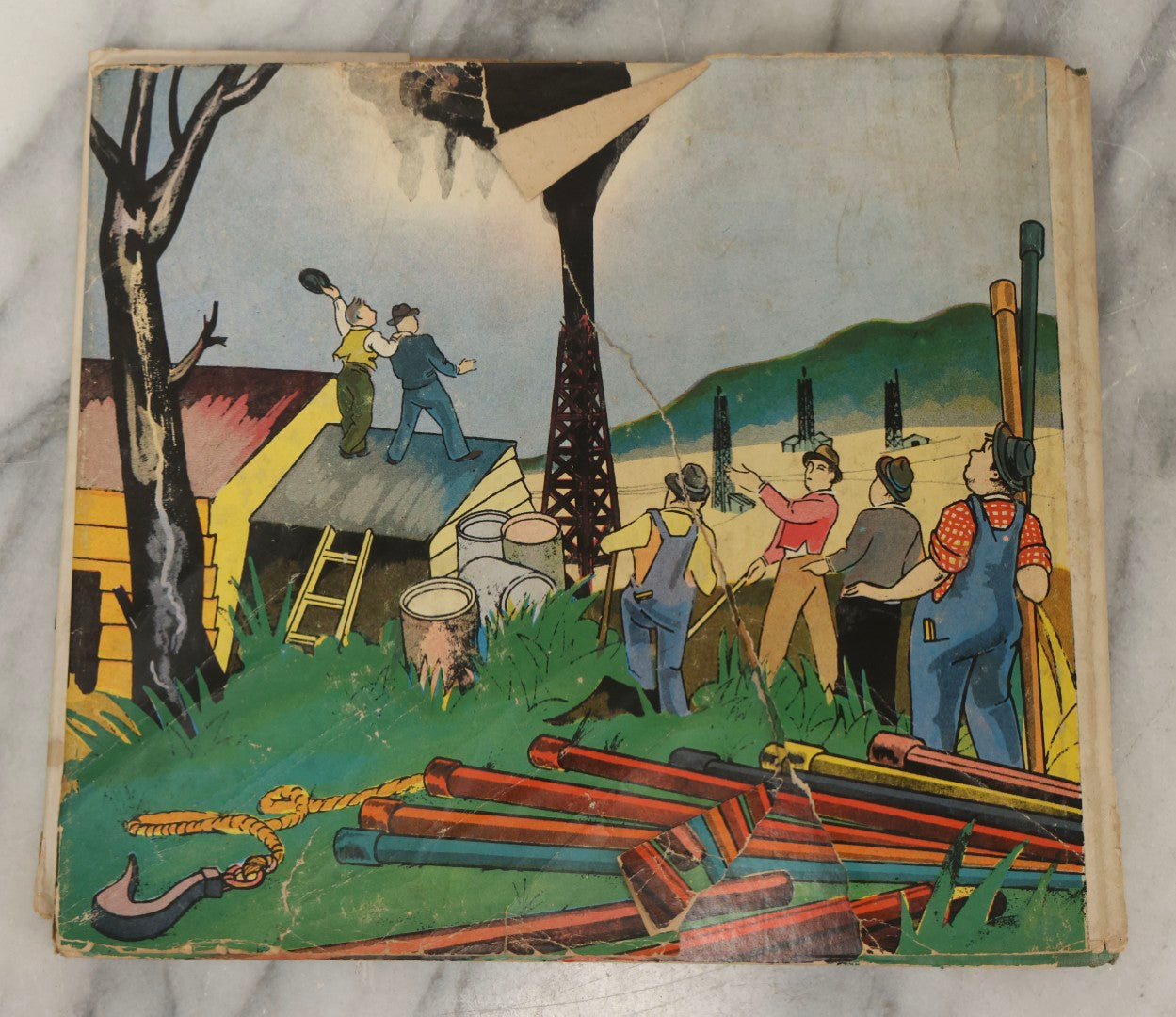 Lot 203 - Grouping Of 3 Antique And Vintage Industrial-Themed Children's Books Including “Railroad Book” By McLoughlin Bros., “Book Of Trains” By Grif Teller, And “Oil Comes To Us” By Rose Wyler And Warren W. McSpadden