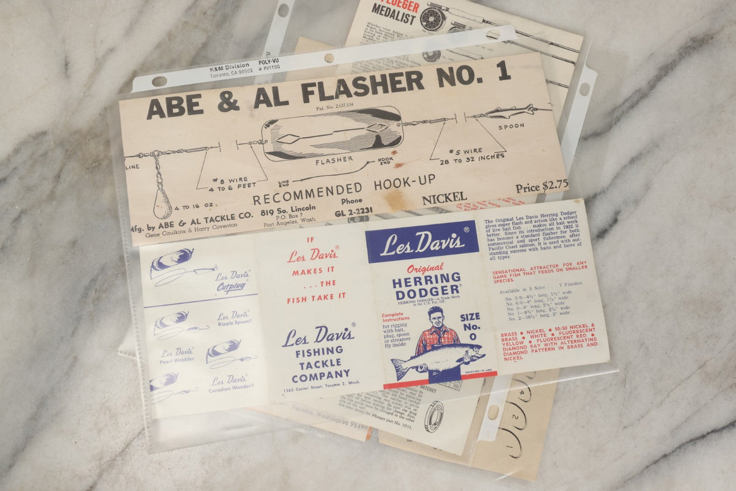 Lot 212 - Grouping Of Vintage Fishing Ephemera Including Pflueger Reel Advertisements And Booklets, "The Nitty Gritty Of Steelhead Fishing" By Dan Stair For Luhr Jensen & Sons, And Shoff Sporting Goods Chart, Kent, Washington