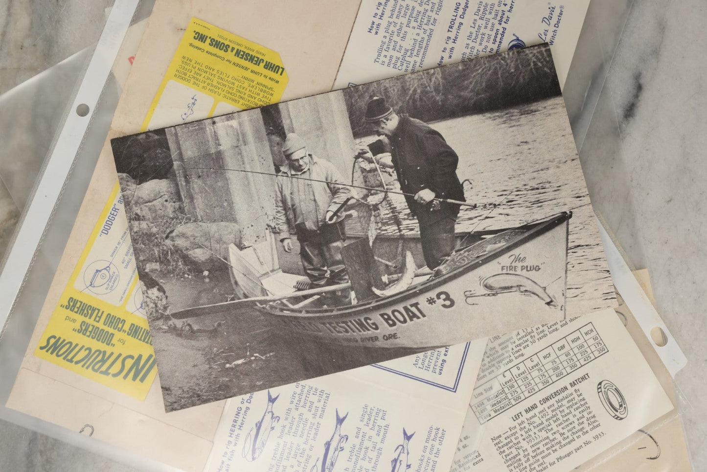 Lot 212 - Grouping Of Vintage Fishing Ephemera Including Pflueger Reel Advertisements And Booklets, "The Nitty Gritty Of Steelhead Fishing" By Dan Stair For Luhr Jensen & Sons, And Shoff Sporting Goods Chart, Kent, Washington