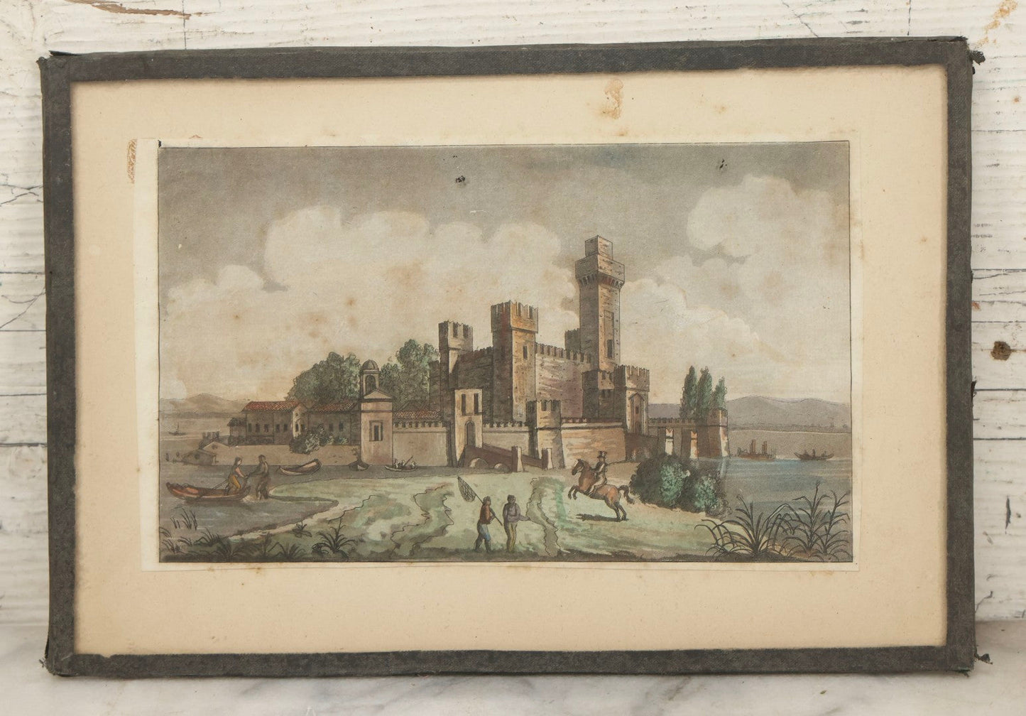 Lot 223 - Antique Hand-Colored Engraving Scaligera Castle, Sirmione, Lake Garda, Italy, Circa Early 19th Century, Mounted Behind Glass With Backing Board And Sealing Tape Border