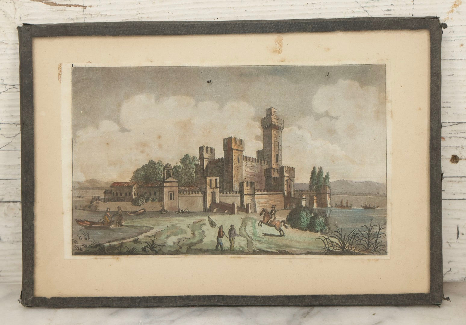 Lot 223 - Antique Hand-Colored Engraving Scaligera Castle, Sirmione, Lake Garda, Italy, Circa Early 19th Century, Mounted Behind Glass With Backing Board And Sealing Tape Border