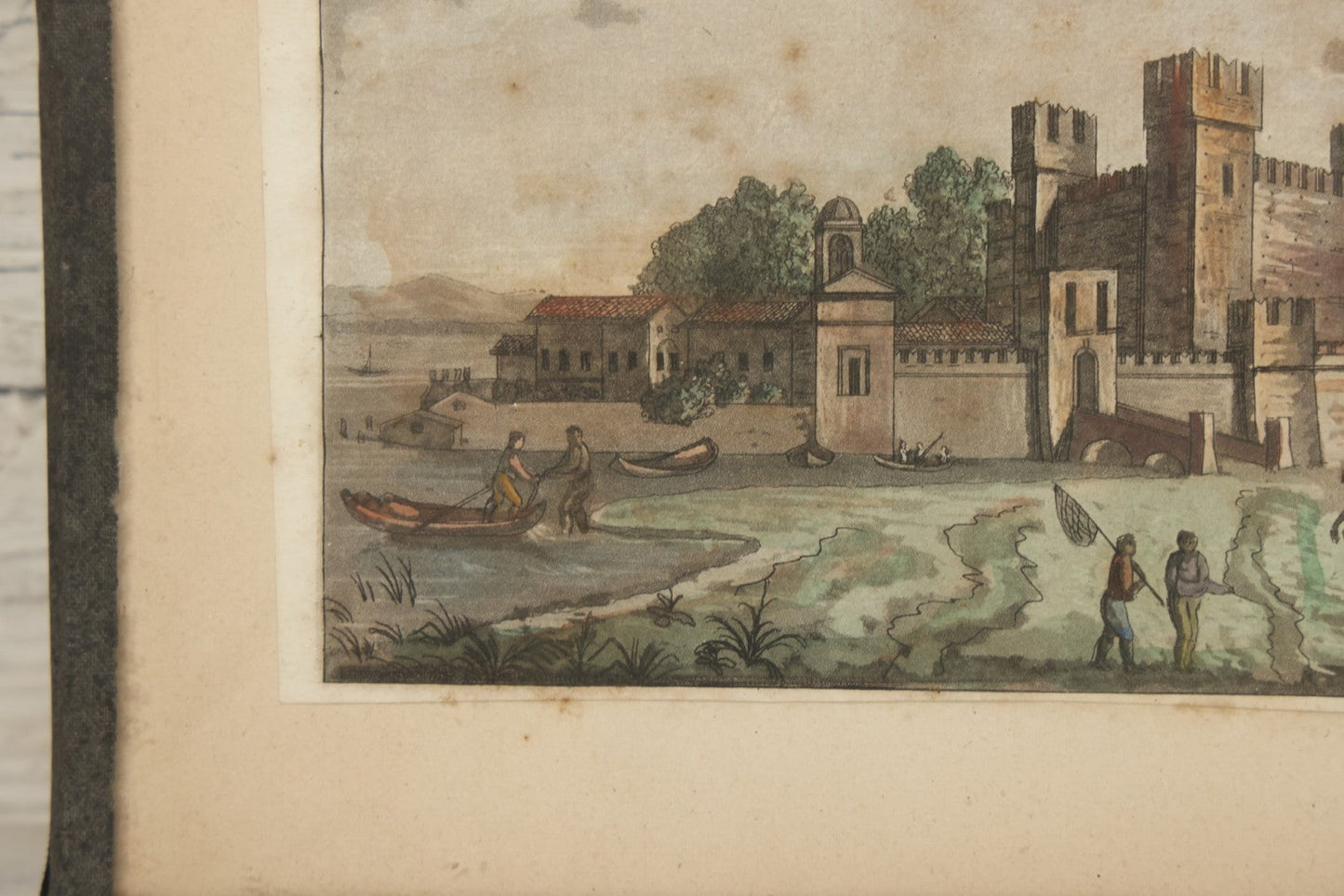 Lot 223 - Antique Hand-Colored Engraving Scaligera Castle, Sirmione, Lake Garda, Italy, Circa Early 19th Century, Mounted Behind Glass With Backing Board And Sealing Tape Border