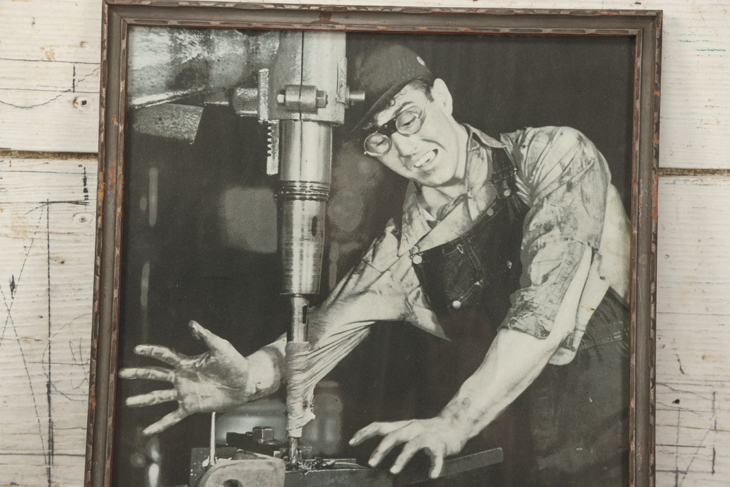 Lot 233 - Vintage Industrial Safety Photograph “Caught!—Floppy Clothing Has No Place Around Moving Machinery,” Signed Sarra, In Gray Painted Frame, 11-1/8" x 12-1/8"