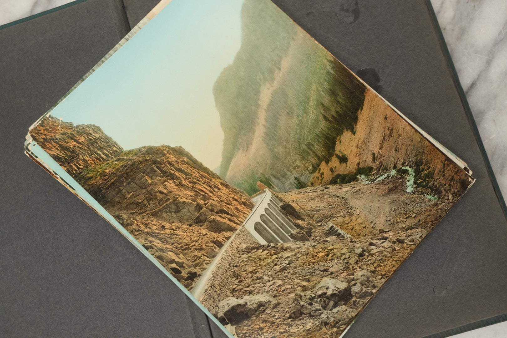Lot 238 - Antique “Postal Cards” Scrapbook Album Containing Yellowstone Photographs, Postcards, And Ephemera Including Large-Format 1898–1902 Prints By Detroit Photographic Co., Ward's Postal Card Album, Boston, Massachusetts
