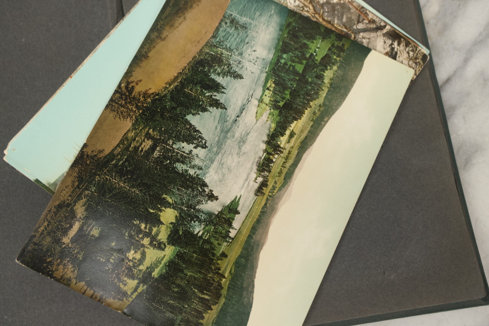Lot 238 - Antique “Postal Cards” Scrapbook Album Containing Yellowstone Photographs, Postcards, And Ephemera Including Large-Format 1898–1902 Prints By Detroit Photographic Co., Ward's Postal Card Album, Boston, Massachusetts