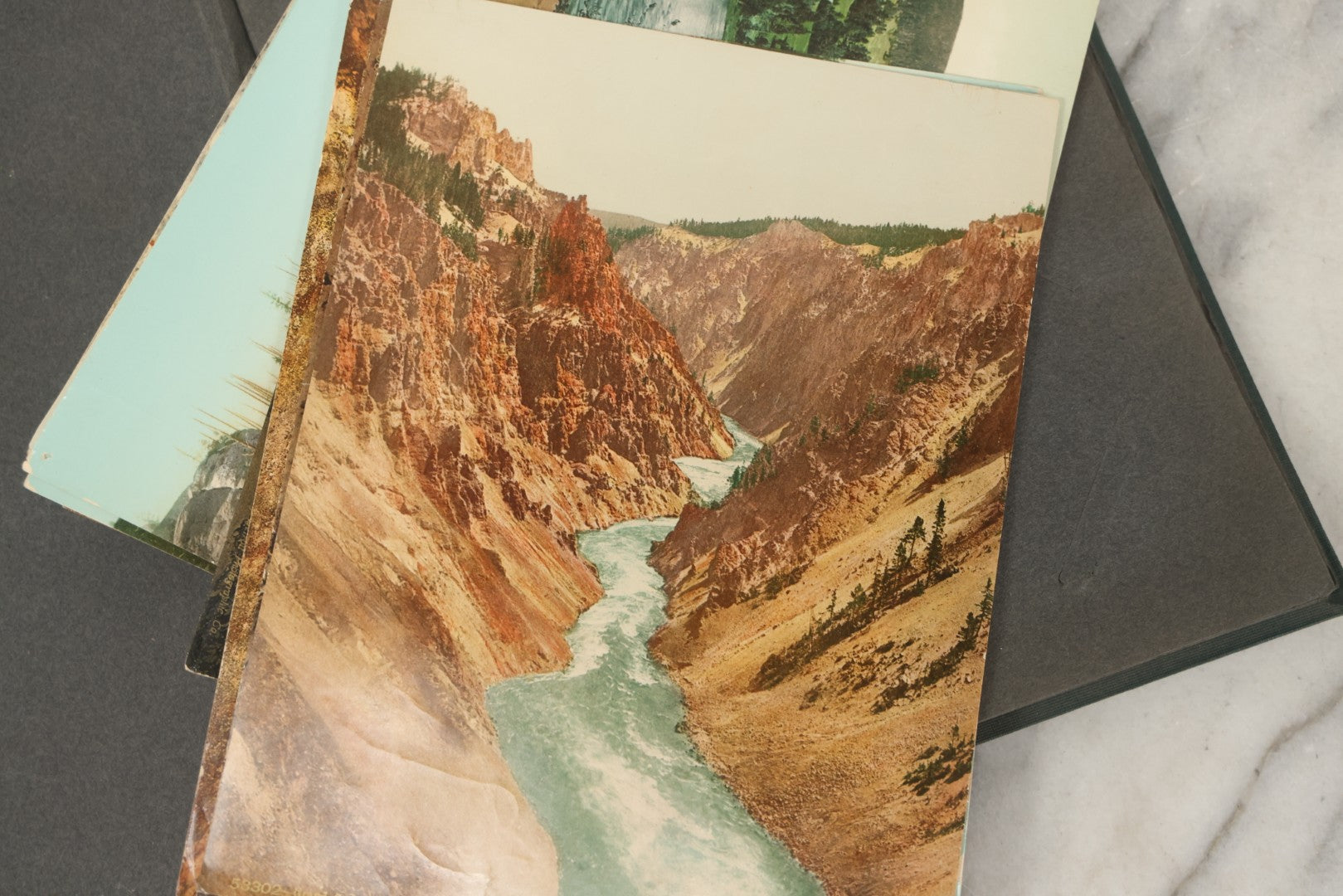 Lot 238 - Antique “Postal Cards” Scrapbook Album Containing Yellowstone Photographs, Postcards, And Ephemera Including Large-Format 1898–1902 Prints By Detroit Photographic Co., Ward's Postal Card Album, Boston, Massachusetts