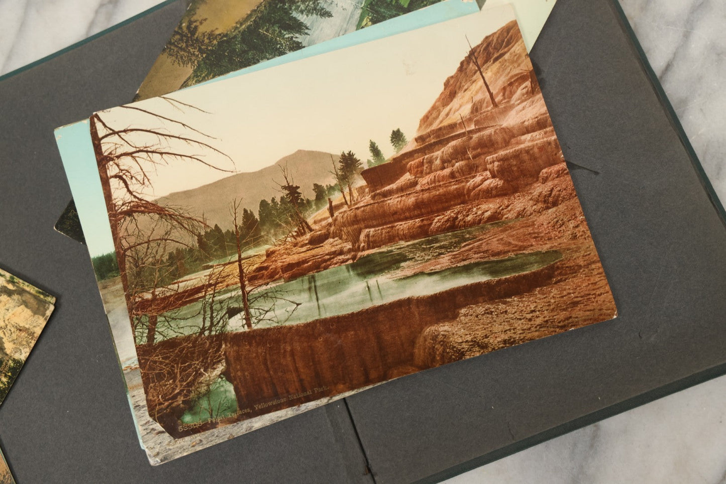 Lot 238 - Antique “Postal Cards” Scrapbook Album Containing Yellowstone Photographs, Postcards, And Ephemera Including Large-Format 1898–1902 Prints By Detroit Photographic Co., Ward's Postal Card Album, Boston, Massachusetts