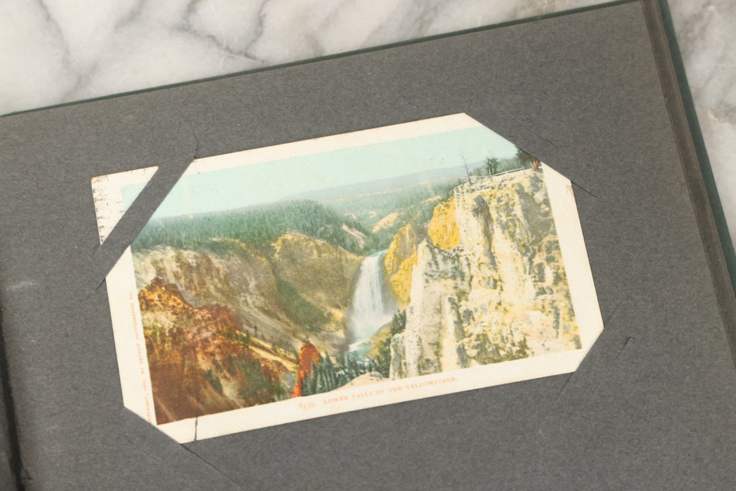 Lot 238 - Antique “Postal Cards” Scrapbook Album Containing Yellowstone Photographs, Postcards, And Ephemera Including Large-Format 1898–1902 Prints By Detroit Photographic Co., Ward's Postal Card Album, Boston, Massachusetts