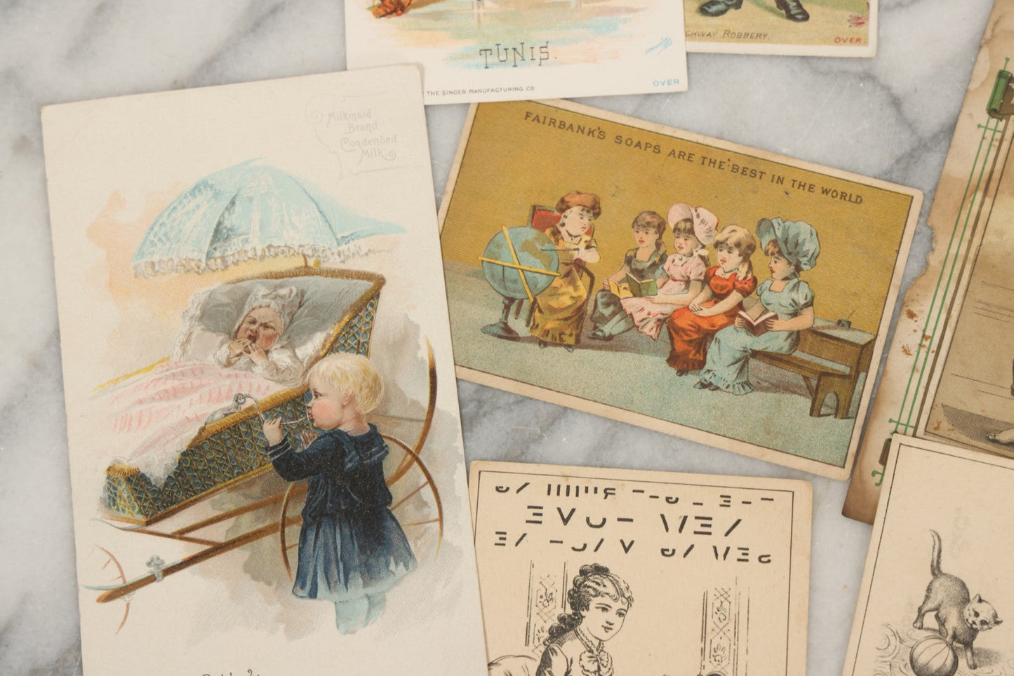 Lot 241 - Grouping Of 15 Antique Victorian Lithographed Trade Card Advertisements Including J. & P. Coates Thread, Milkmaid Brand Condensed Milk, Henkel's Baking Powder, Boston Brass Andirons, Fairbanks Soap, And Singer Manufacturing Co. Sewing Machines