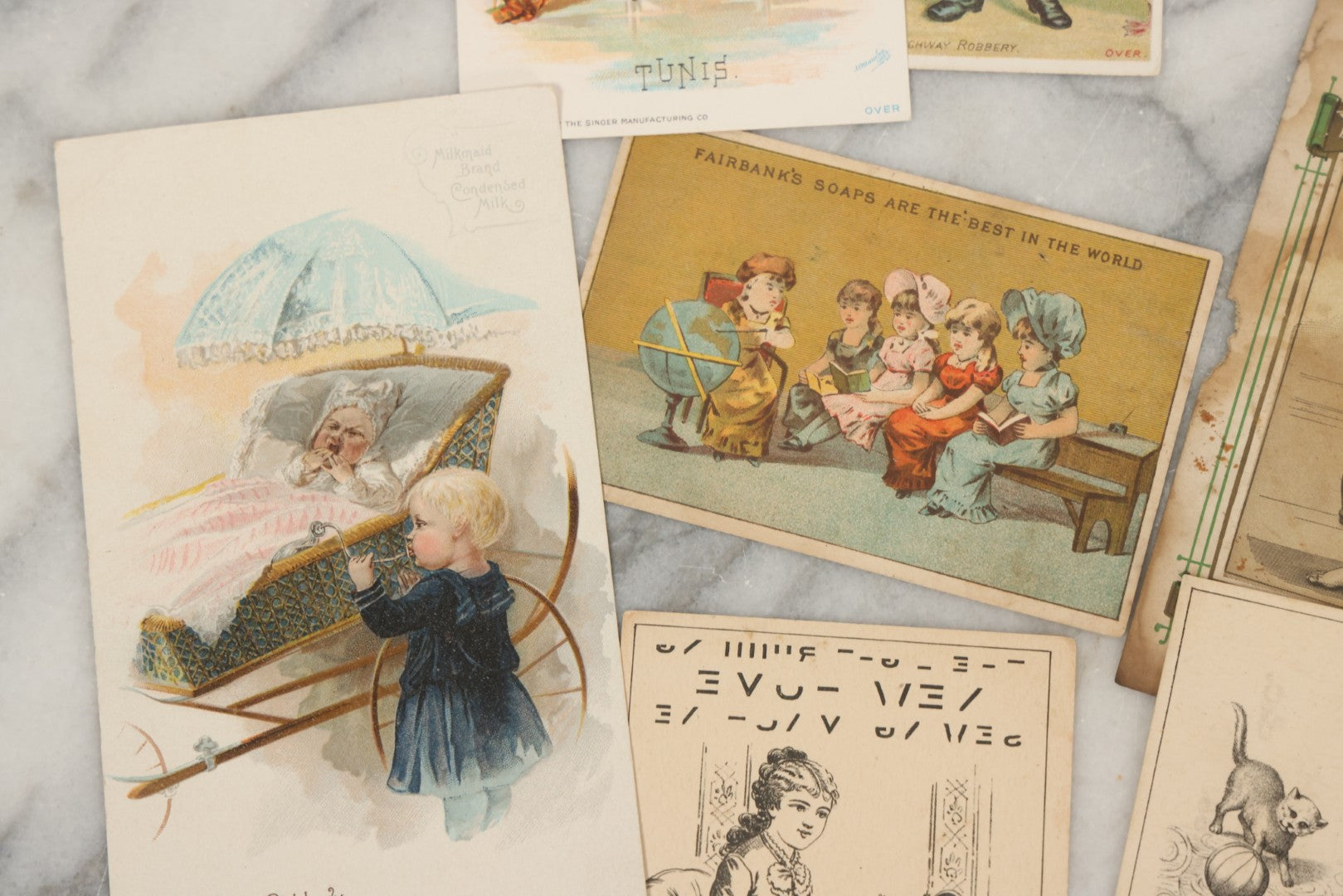 Lot 241 - Grouping Of 15 Antique Victorian Lithographed Trade Card Advertisements Including J. & P. Coates Thread, Milkmaid Brand Condensed Milk, Henkel's Baking Powder, Boston Brass Andirons, Fairbanks Soap, And Singer Manufacturing Co. Sewing Machines