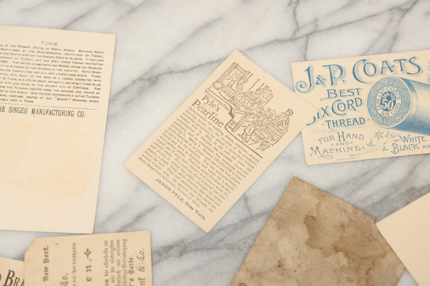 Lot 241 - Grouping Of 15 Antique Victorian Lithographed Trade Card Advertisements Including J. & P. Coates Thread, Milkmaid Brand Condensed Milk, Henkel's Baking Powder, Boston Brass Andirons, Fairbanks Soap, And Singer Manufacturing Co. Sewing Machines