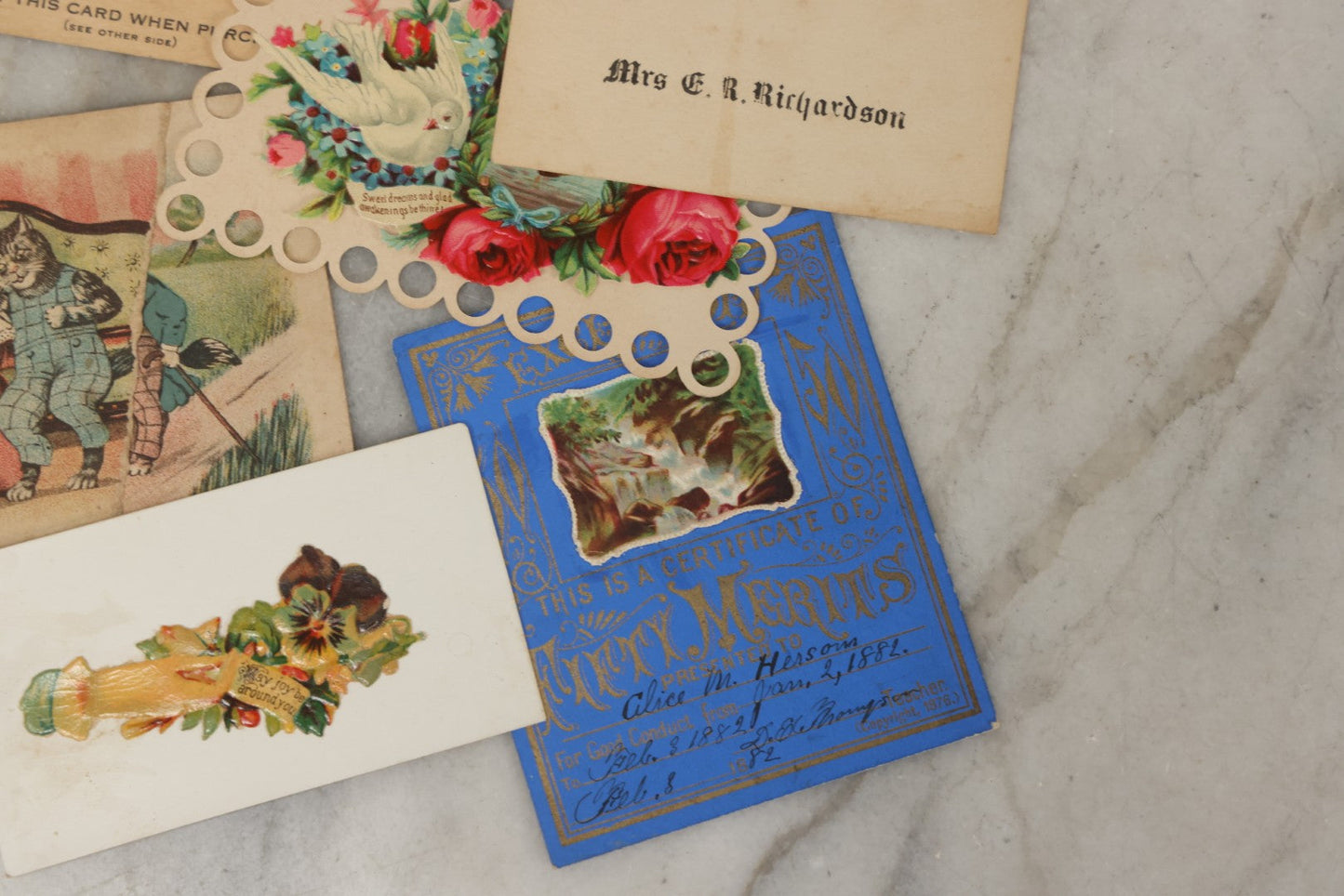 Lot 242 - Grouping Of 15 Antique And Vintage Mixed Ephemera Scraps Including Novelty Space Money From Neptune, 1882 Award Of Merit, Hand Motif Calling Cards, New England Jewelry Co. Coupon, Cat Booklet, Yellowstone Decal, And Erma EP22 Pistol Booklet
