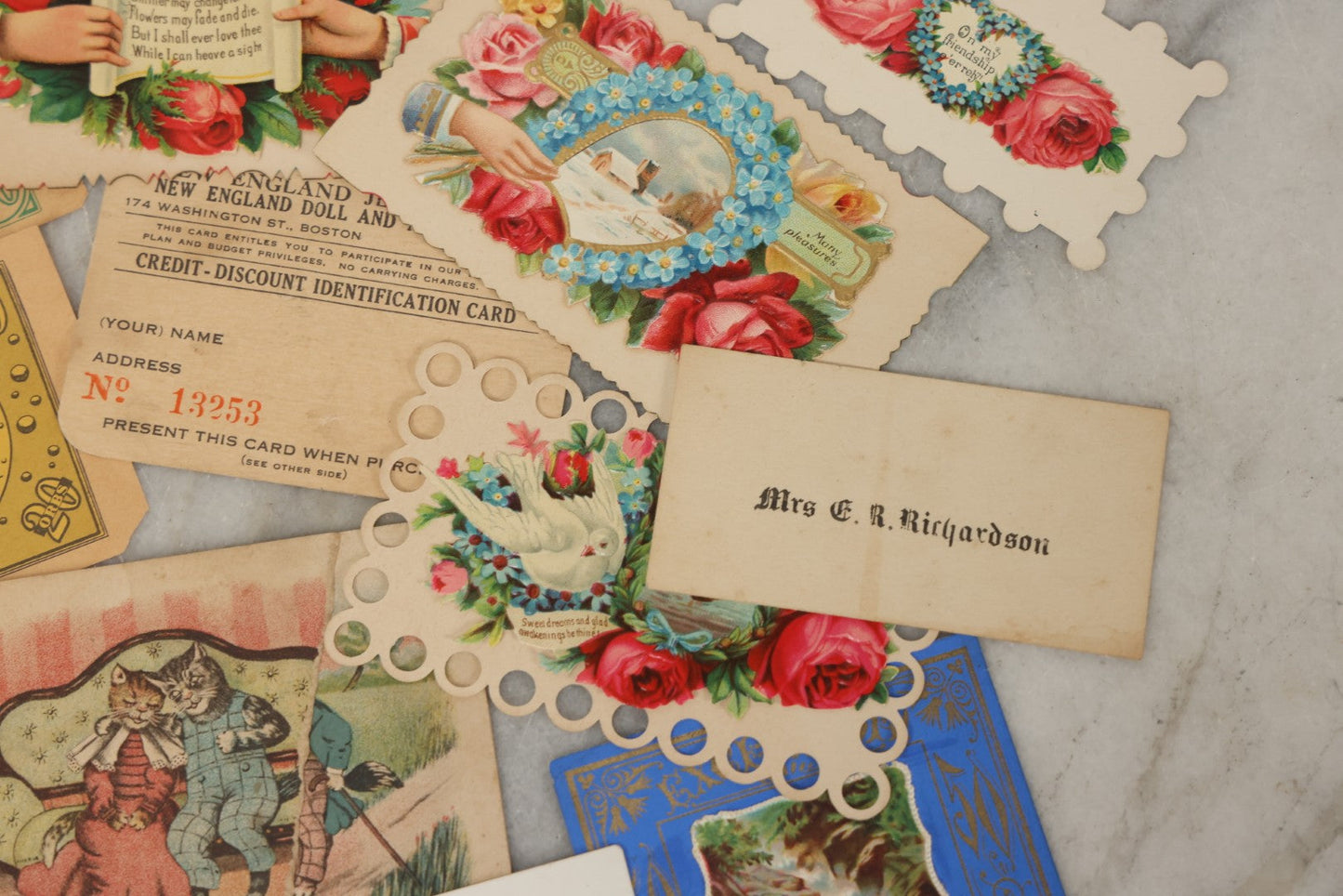 Lot 242 - Grouping Of 15 Antique And Vintage Mixed Ephemera Scraps Including Novelty Space Money From Neptune, 1882 Award Of Merit, Hand Motif Calling Cards, New England Jewelry Co. Coupon, Cat Booklet, Yellowstone Decal, And Erma EP22 Pistol Booklet