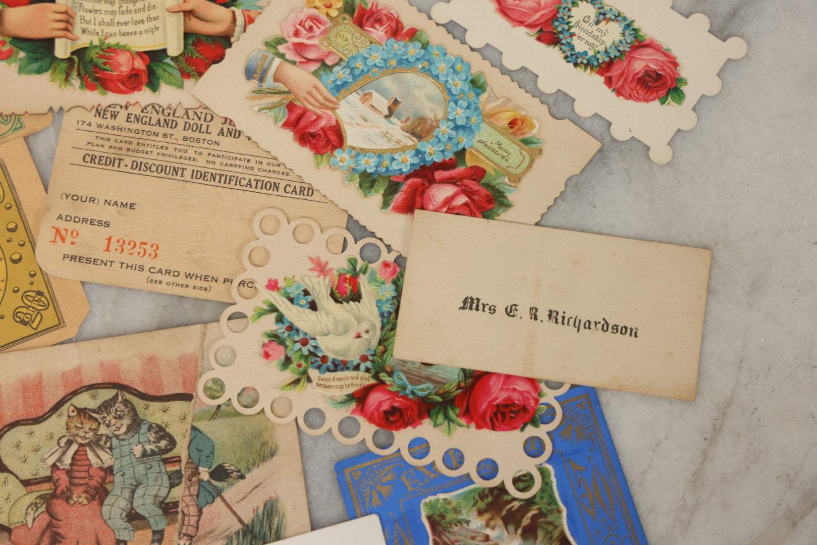 Lot 242 - Grouping Of 15 Antique And Vintage Mixed Ephemera Scraps Including Novelty Space Money From Neptune, 1882 Award Of Merit, Hand Motif Calling Cards, New England Jewelry Co. Coupon, Cat Booklet, Yellowstone Decal, And Erma EP22 Pistol Booklet